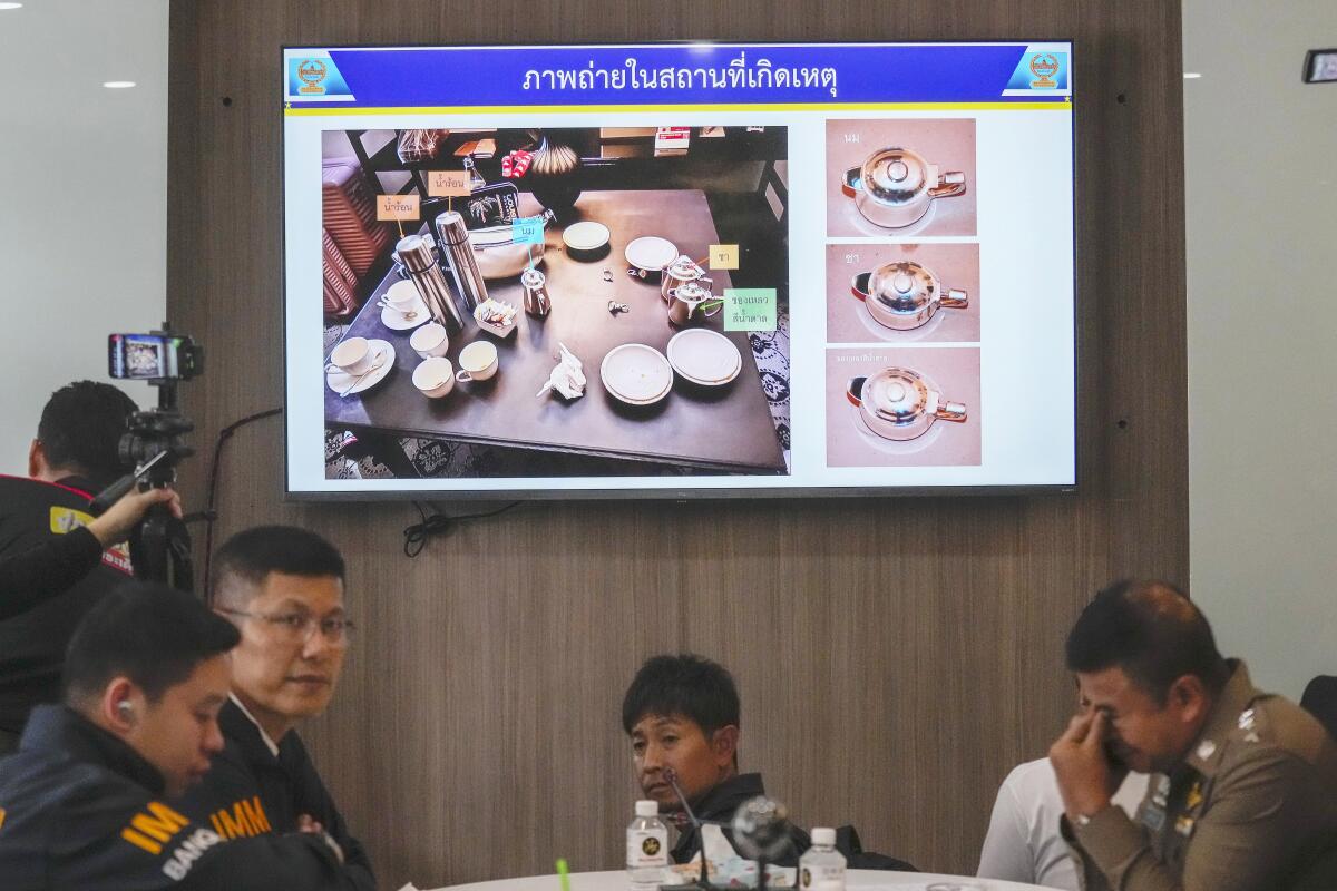 Thai police display pictures of evidence during a press conference.