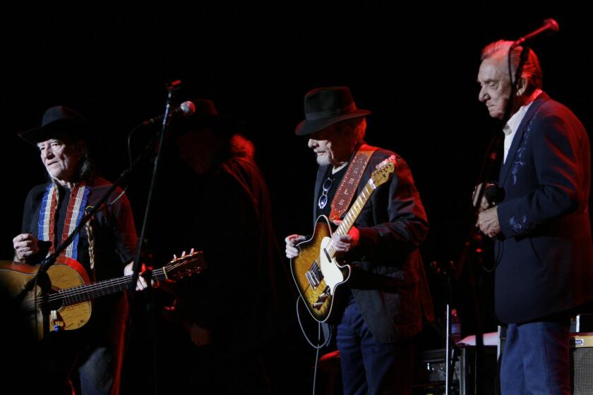 Willie Nelson, left, performs with Merle Haggard and Ray Price in Las Vegas in 2007 on their "Last of the Breed" tour.