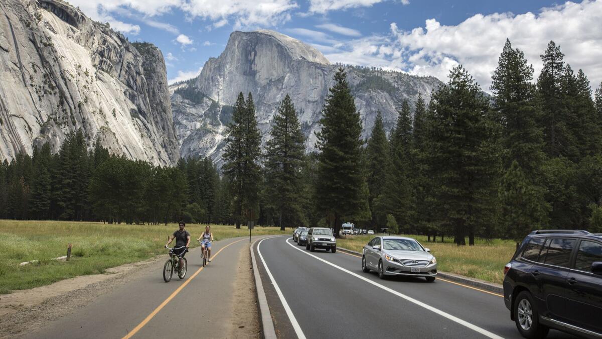 Traffic backs up along a road on the Yosemite Valley floor in July 2017.