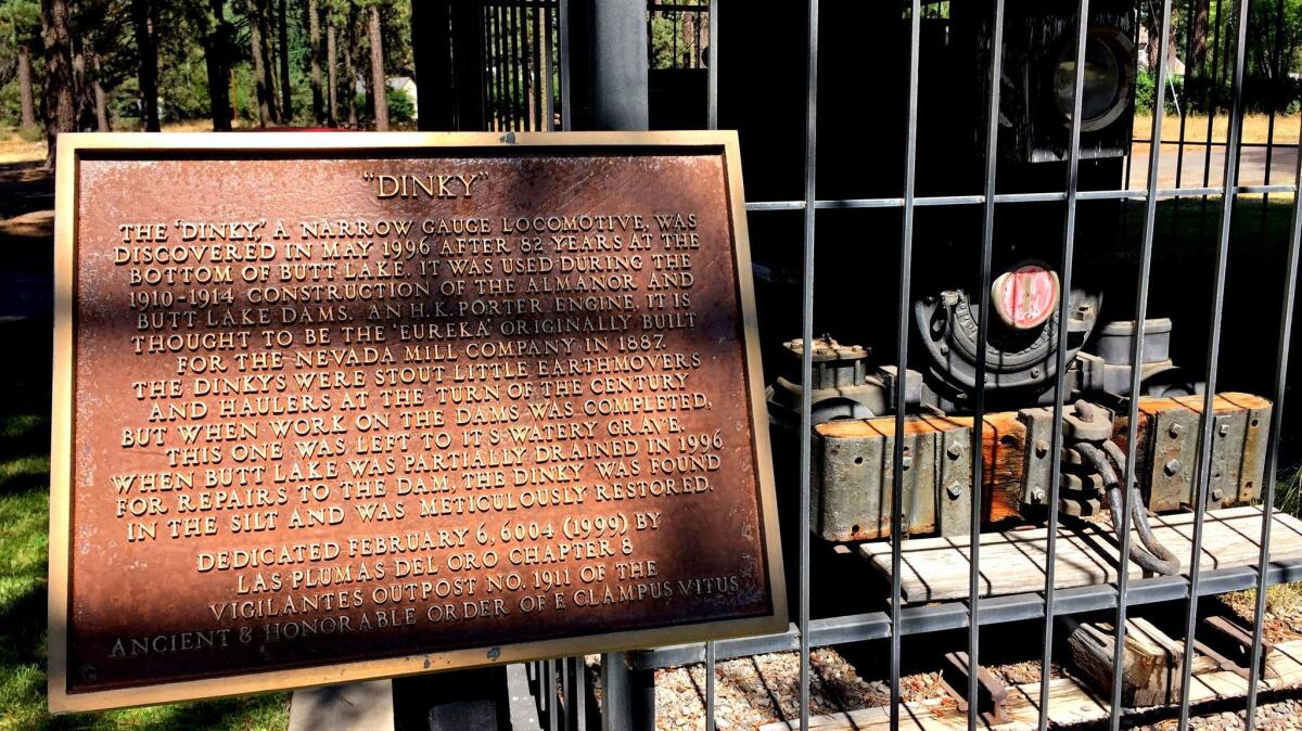 A plaque placed by E Clampus Vitus stands beside the Butt Lake Dinky in Chester, Calif.