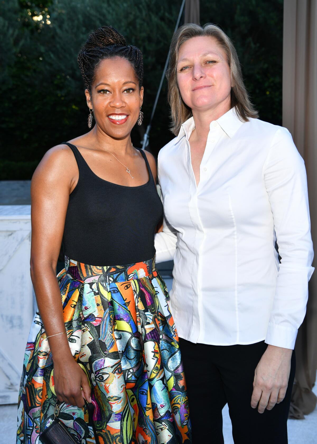Emmy winner Regina King and Netflix Vice President of Original Series Cindy Holland attend a pre-Emmy party Saturday.