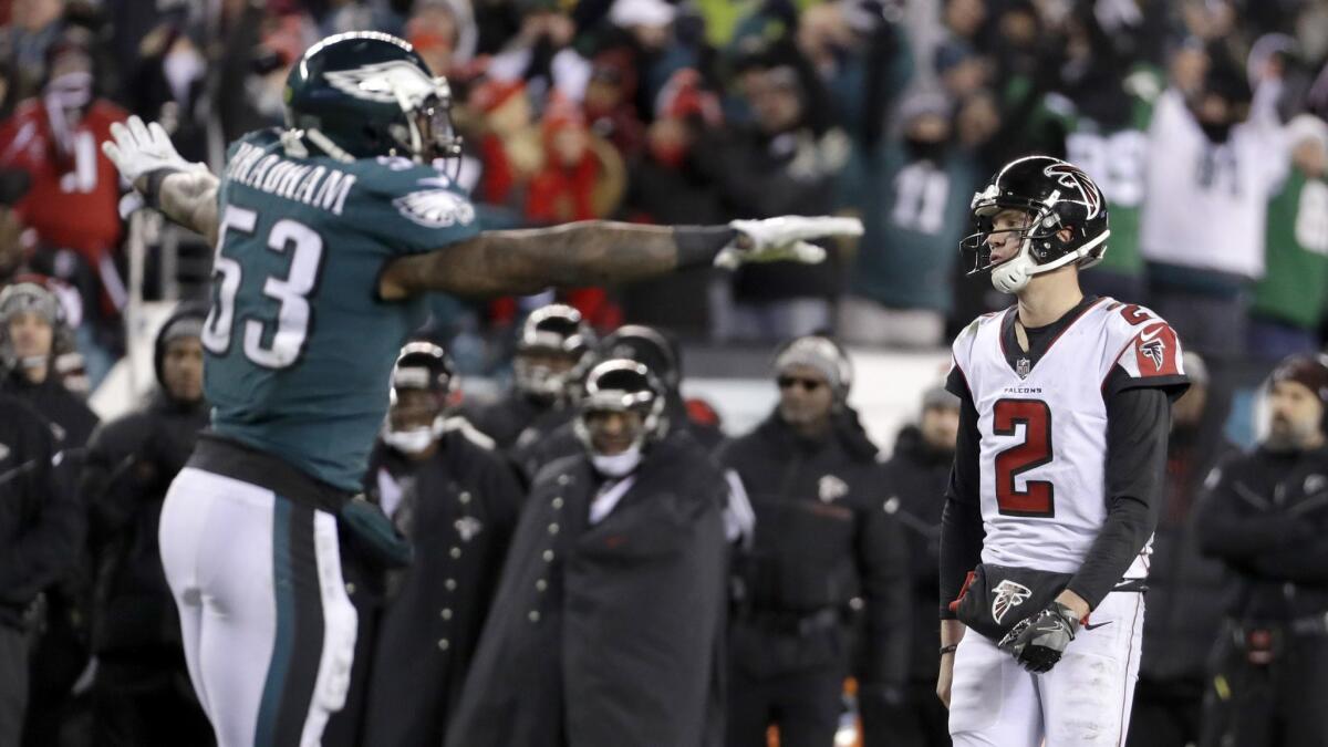 The Eagles' Nigel Bradham celebrates near Atlanta quarterback Matt Ryan after a failed fourth-and-goal play during last year's NFC divisional playoffs.