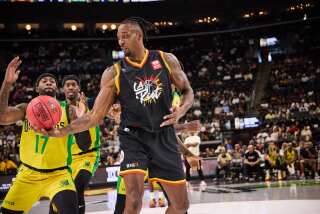 L.A. Riot's Dwight Howard dangles the ball in front of Boston Riot players during a game at the Intuit Dome.