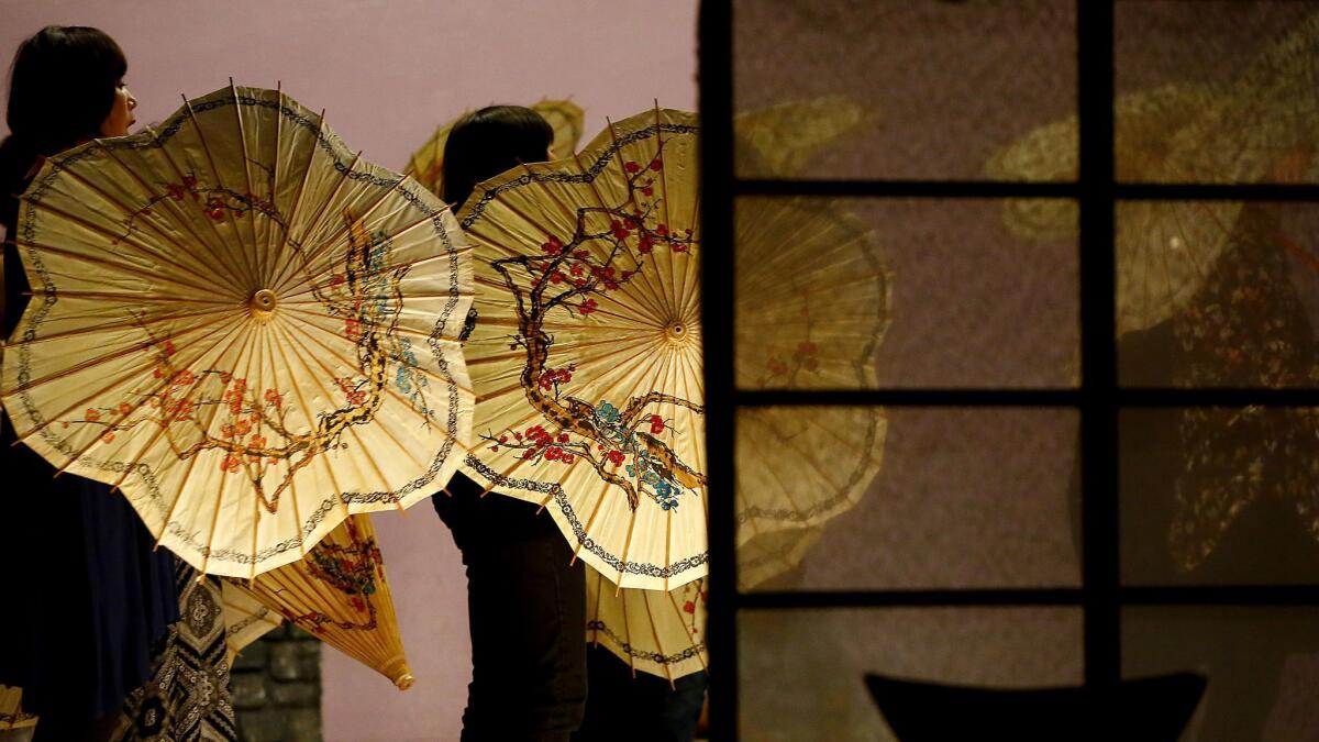 Cherry blossom umbrellas in action during a recent "Madama Butterfly" rehearsal.