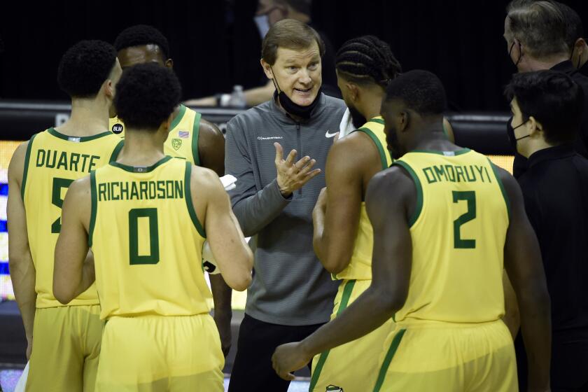 Oregon head coach Dana Altman talks with his during the second half of an NCAA college basketball game Thursday, Feb. 18, 2021, in Eugene, Ore. (AP Photo/Andy Nelson)