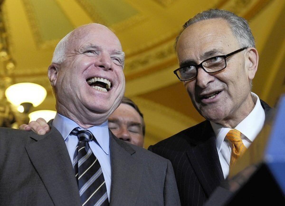 Sens. John McCain (R-Ariz.), left, and Charles E. Schumer (D-N.Y.) spent days negotiating a plan to end the filibuster standoff in the Senate.