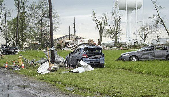 The countryside is littered with damaged cars and debris after several tornadoes ripped through Adair County on Wednesday evening, causing extensive damage to Kirksville, Mo., while claiming at least three lives.
