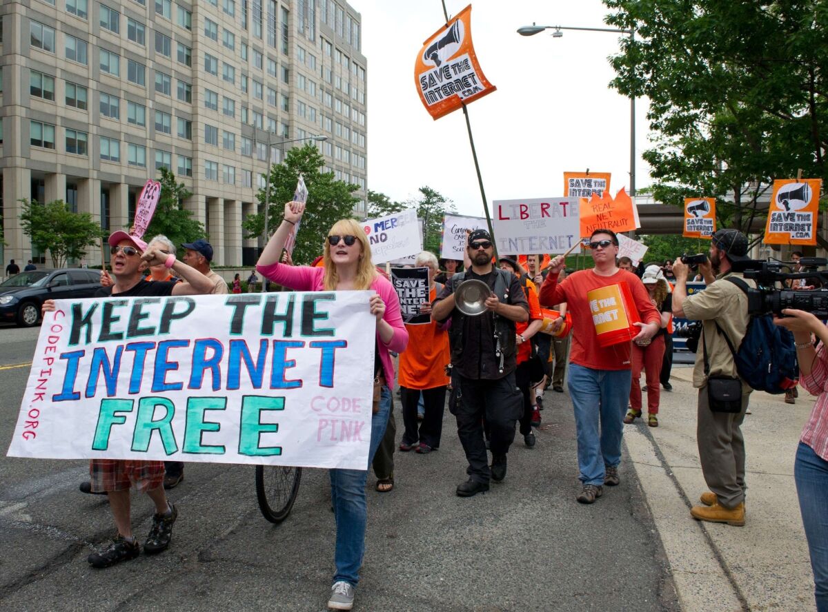 Protesters rally to support net neutrality.