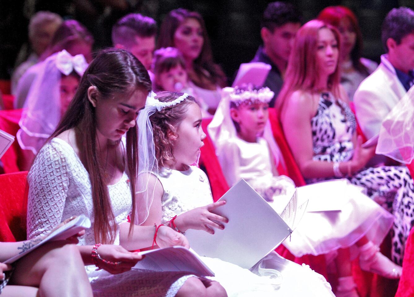 Photo Gallery: Circus priest performs Sacraments of Initiation at Circus Vargas in Burbank