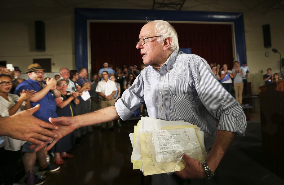 Democratic presidential candidate Sen. Bernie Sanders greets supporters after speaking at his town hall meeting at Woodbury School in Salem, N.H. on Aug. 23.