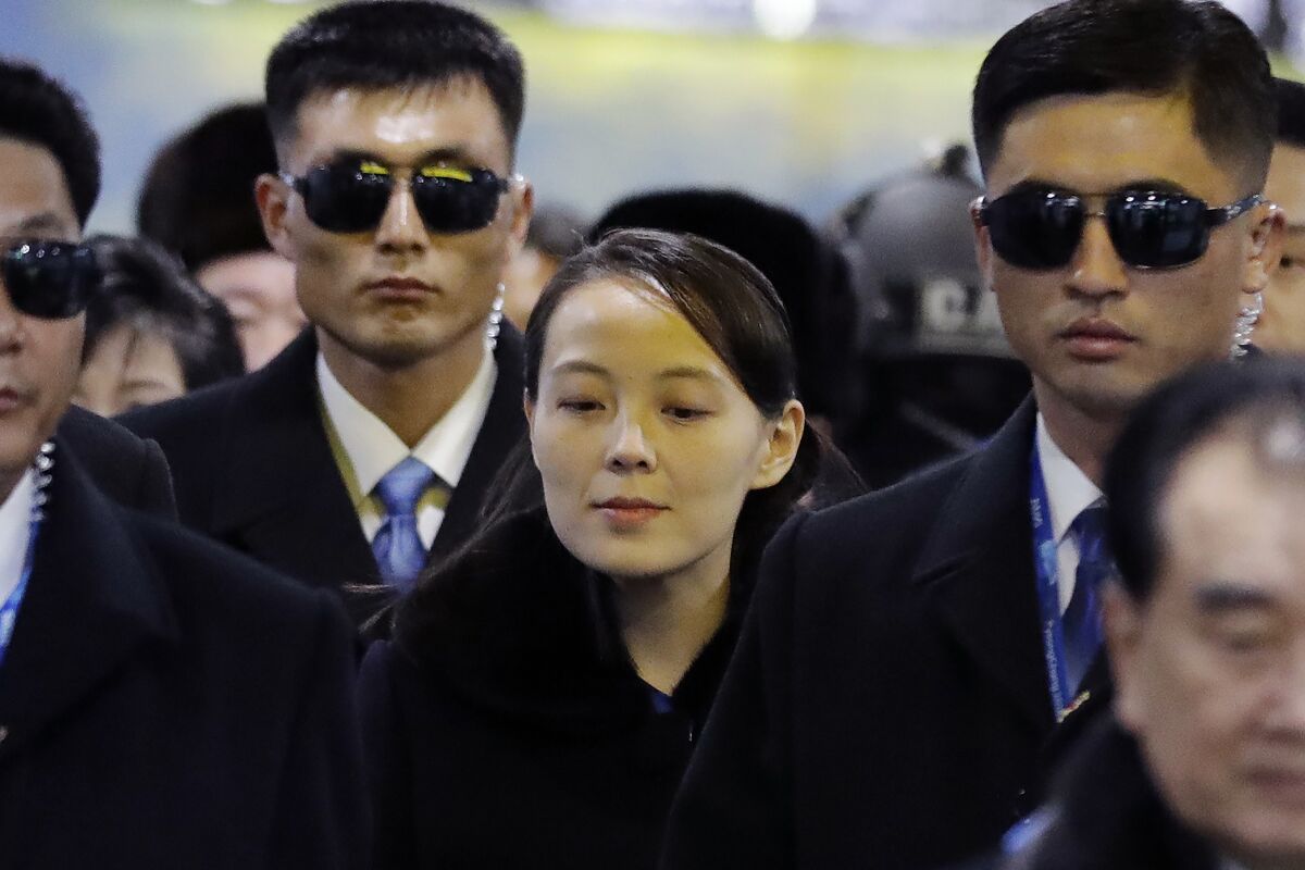 FILE - In this Feb. 9, 2018, file photo, North Korean leader Kim Jong Un's younger sister Kim Yo Jong, center, arrives at the Jinbu train station in Pyeongchang, South Korea. As North Korea goes back to its pattern of pressuring South Korea to get what it wants from the United States, the powerful sister of leader Kim Jong Un has emerged as the face of its campaign of mixing weapons demonstrations and peace offers. (AP Photo/Lee Jin-man, File)