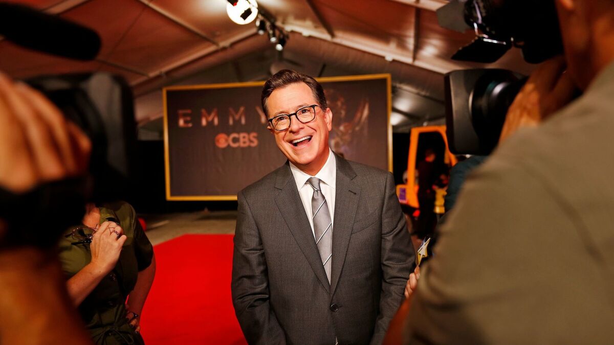 Emmy Awards telecast host Stephen Colbert talks to media following the official red carpet rollout for the 69th Emmy Awards at the Microsoft Theater in Los Angeles.