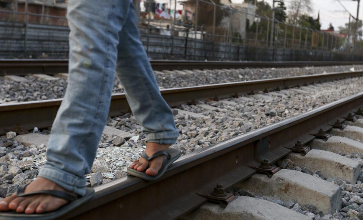 Migrants from Central American have found it increasingly difficult to cross Mexico to reach the United States. Berfilio Hernandez, 21, from Peten, Guatemala, walks along train tracks in Tultitlan, Mexico, last year.