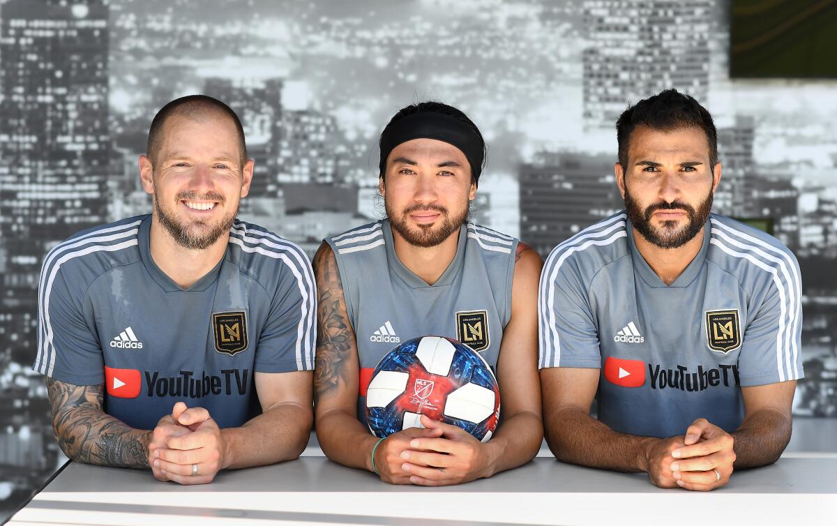 From left, LAFC players Jordan Harvey, Lee Nguyen and Steven Beitashour sport beards and vow not to shave until they win the MLS Cup title.