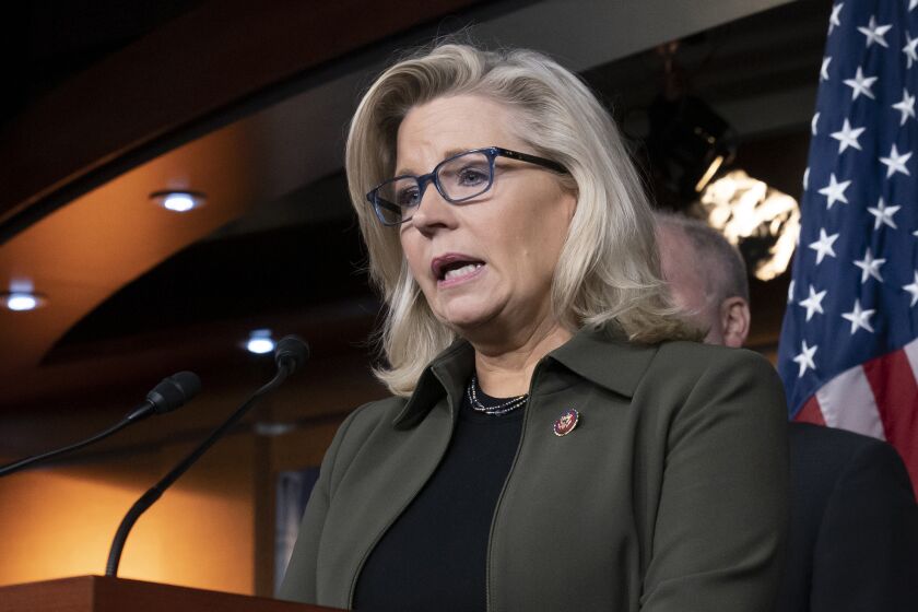 FILE - In this Dec. 17, 2019 file photo, Rep. Liz Cheney, R-Wyo., speaks with reporters at the Capitol in Washington. House Republicans facing electoral uncertainty in November turned on one another in a private meeting on Tuesday, July 21, 2020, as a small group of conservative lawmakers confronted House Republican Conference Chair Liz Cheney over what they said was disloyalty to President Donald Trump. (AP Photo/J. Scott Applewhite, File)