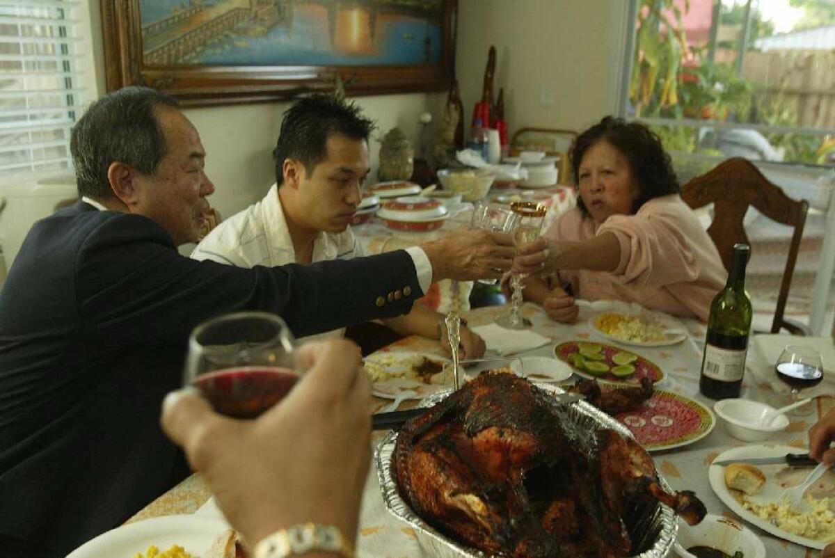 Ted Ngoy celebrates Thanksgiving with his family in 2004. (Gary Friedman / Los Angeles Times)