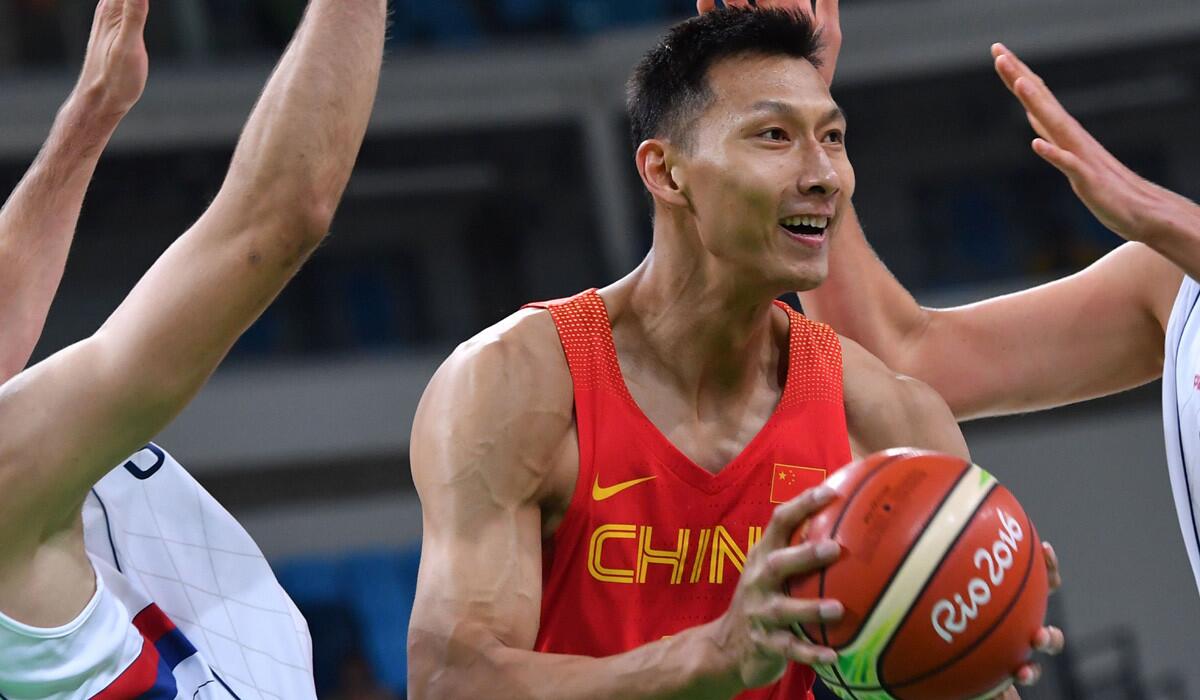 Yi Jianlian runs with the ball during a men's round Group A basketball match between Serbia and China during the 2016 Rio Olympics on Aug. 14.