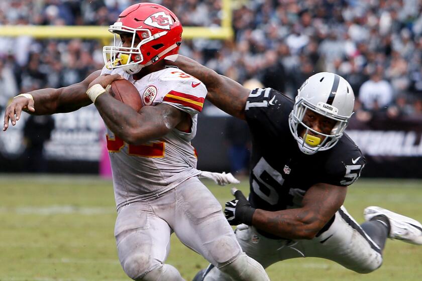 Chiefs running back Spencer Ware, breaking a tackle by Raiders linebacker Bruce Irvin, rushed for 131 yards Sunday.
