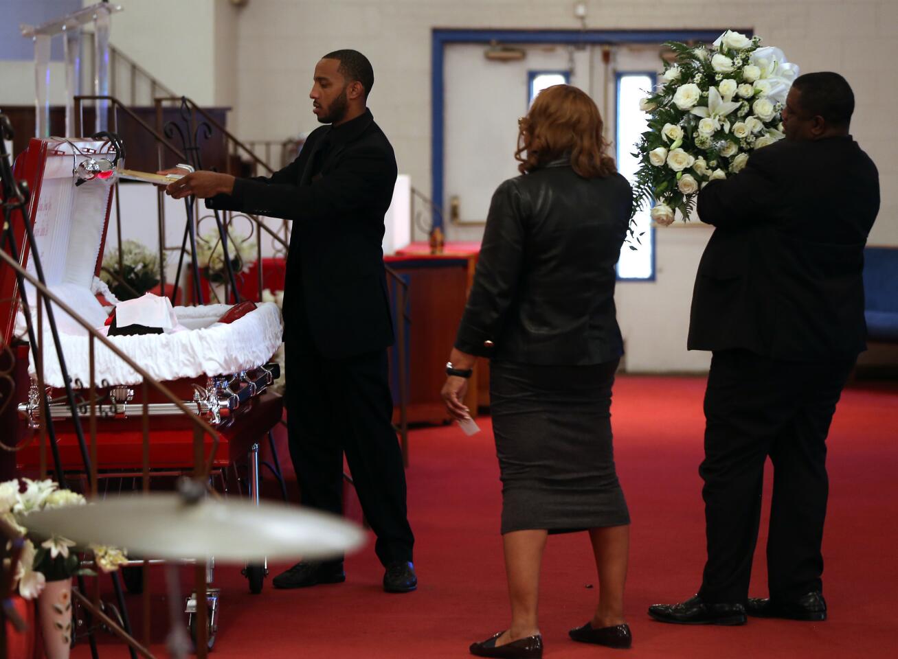 Final preparations are made to the casket for Tyshawn Lee's body Nov. 9, 2015, before a visitation at Haven of Rest Church in Chicago. Tyshawn, 9, was fatally shot Nov. 2 on Chicago's South Side.