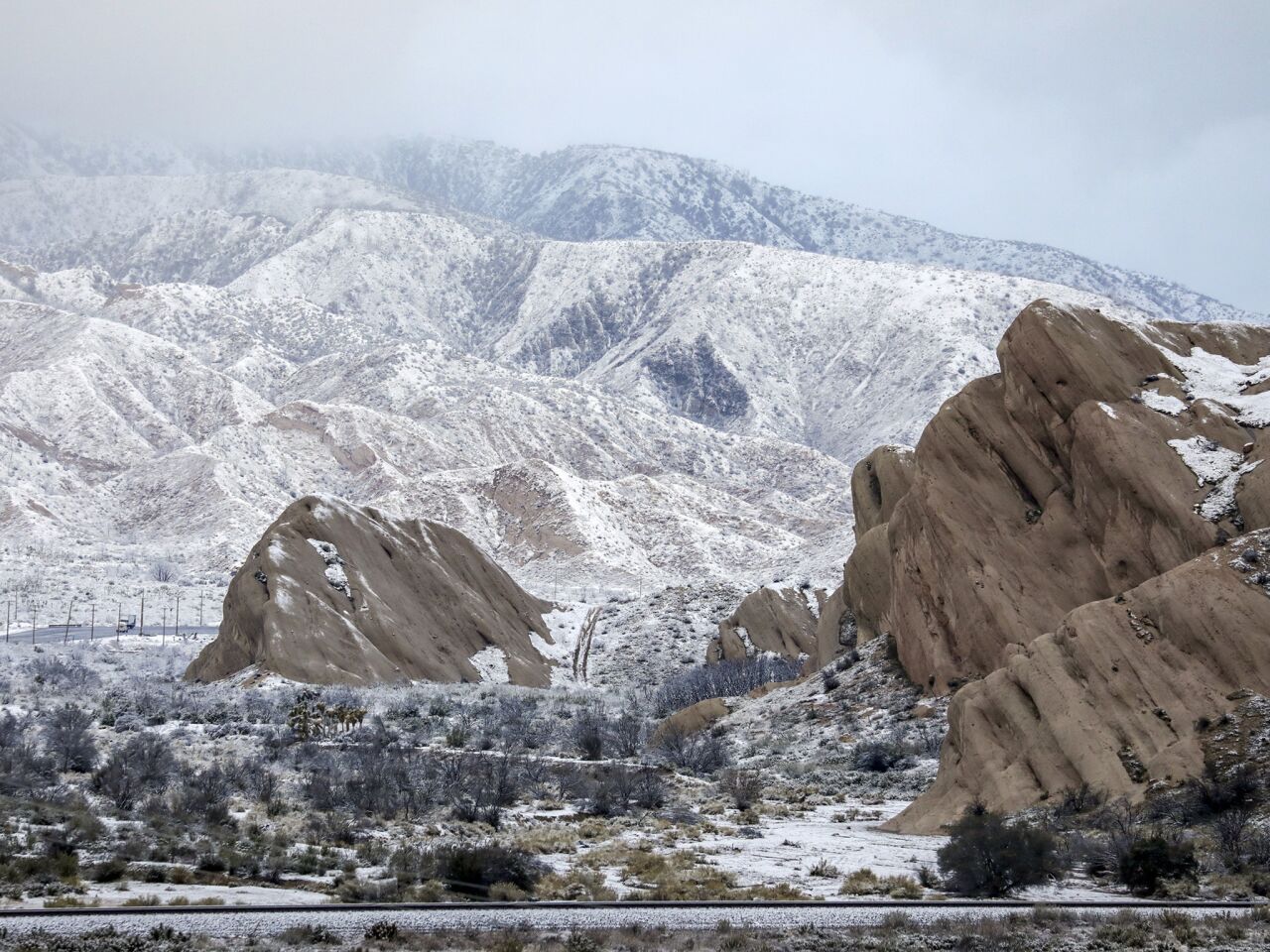 The Mormon Rocks along Highway 138 are dusted in snow Thursday morning.