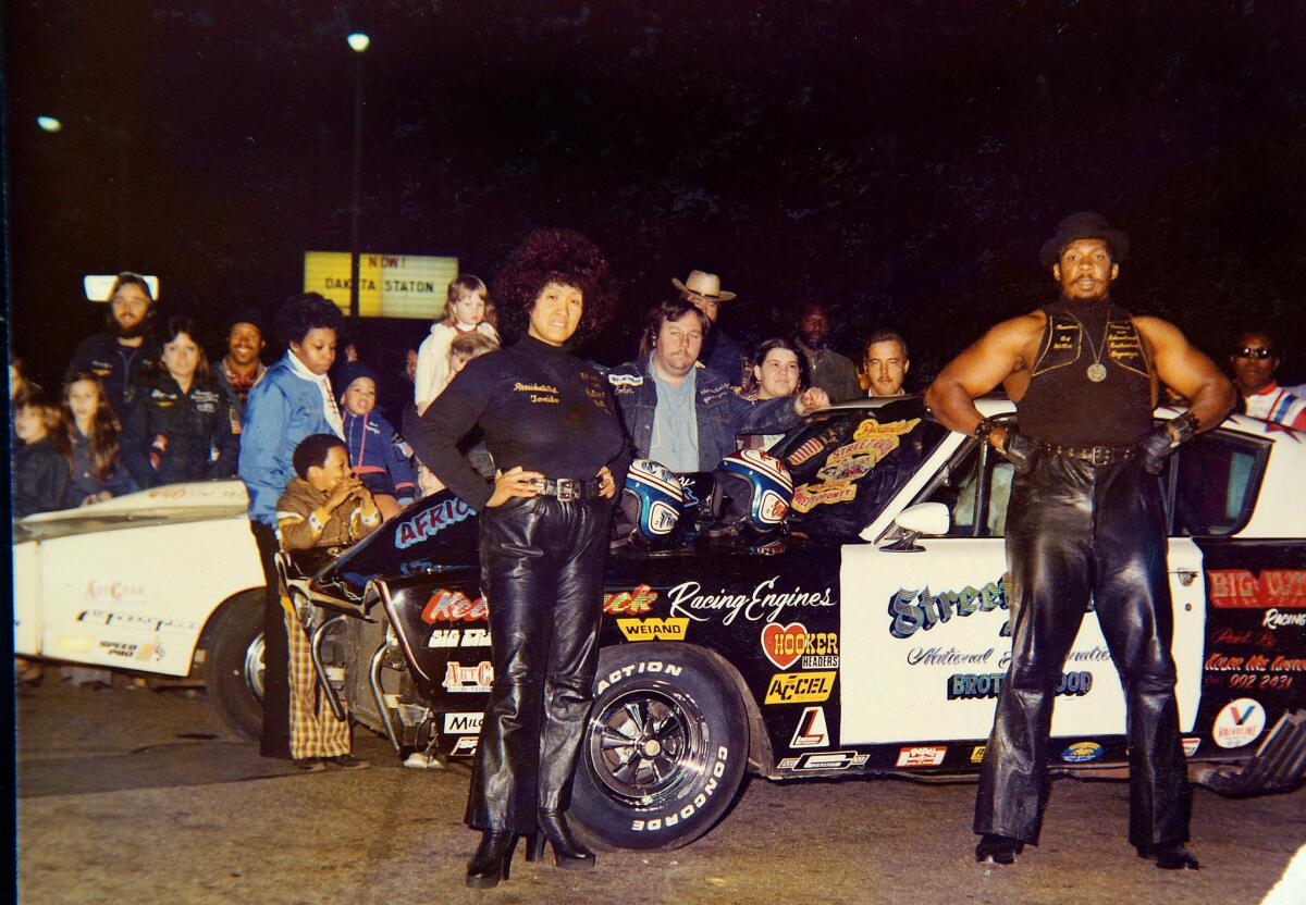 Tomiko Robinson, left, was instrumental in helping Big Willie carry out his mission of peace through wheels. The two had matching race cars, hers called the Queen Daytona and his the King Daytona.