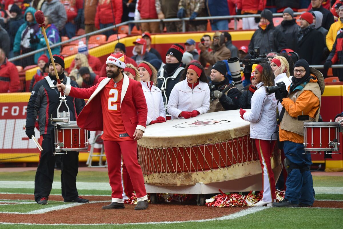 Actor and Chiefs fan Paul Rudd prepares to strike the ceremonial war drum before a game at Arrowhead Stadium in Kansas City, Mo., on Dec. 27, 2015.