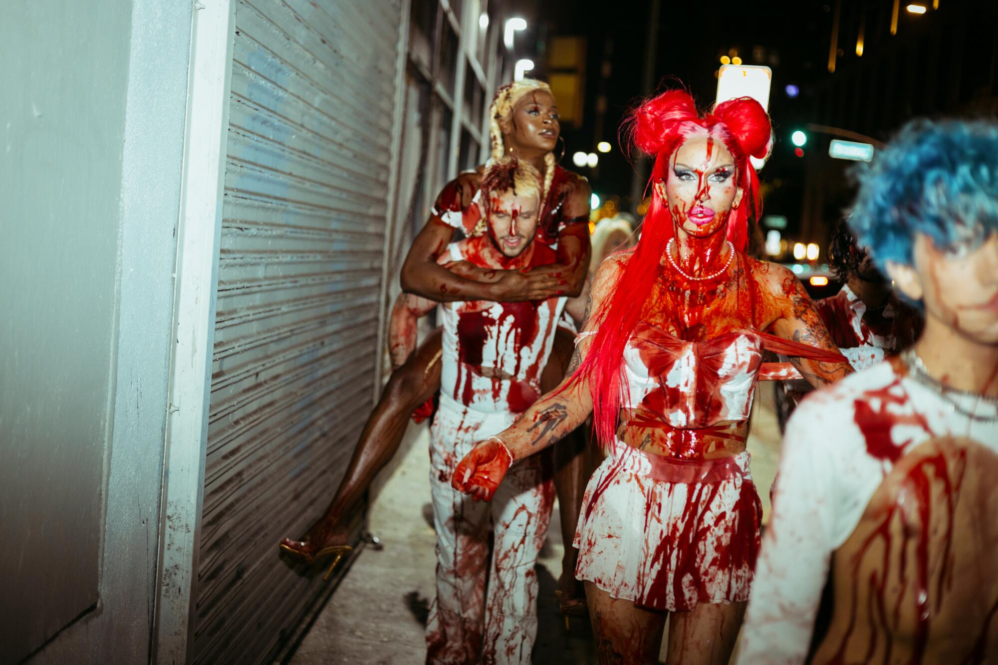 From left: Symone, Marko Monroe, Rylie Holden and Caleb F walking to Precinct. 