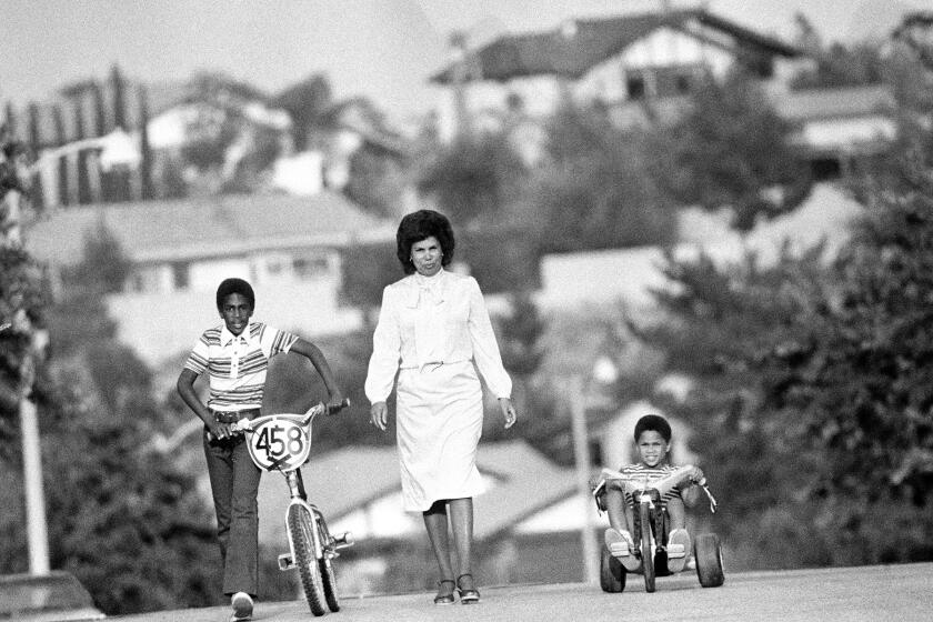 I'm not trying to be white--I never have. And I'm not trying to make my kids white. I'm trying to give them a nice home, good opportunities and advantages, but I'm not trying to make them white.'--Carolyn Brown of Northridge with sons Marc, 10, and Michael, 5. This is from Black Los Angeles project