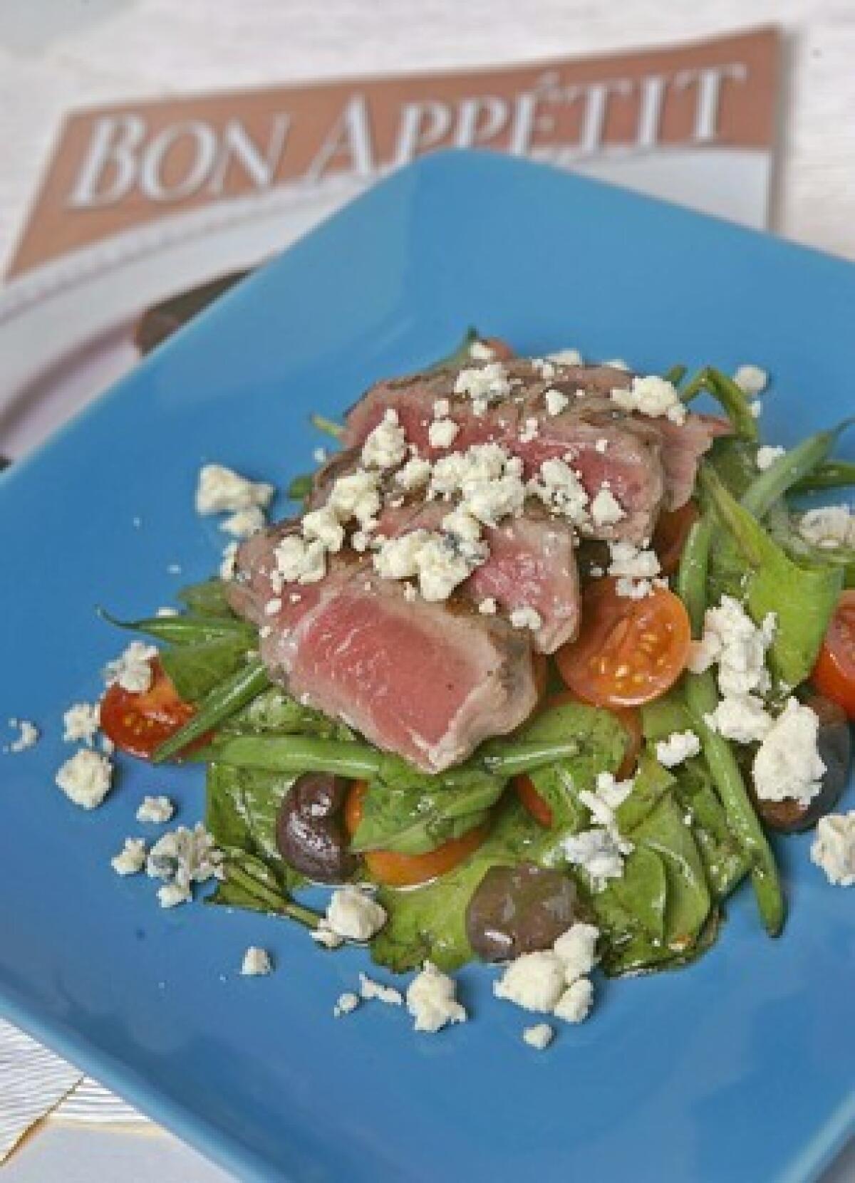 Grilled steak salad with green beans and blue cheese.