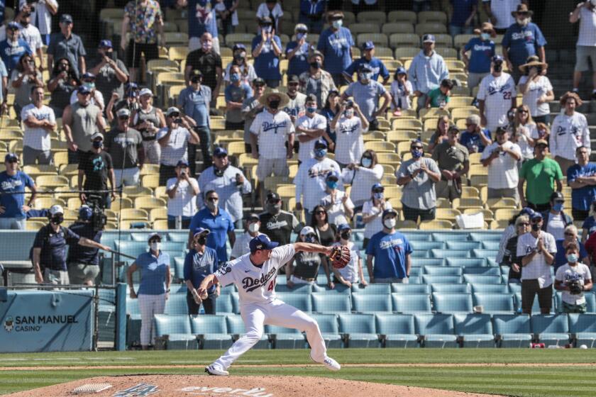 Dodgers reliever Corey Knebel delivers the final pitch of the game as he saves a 1-0 win over the Nationals on April 9, 2021.