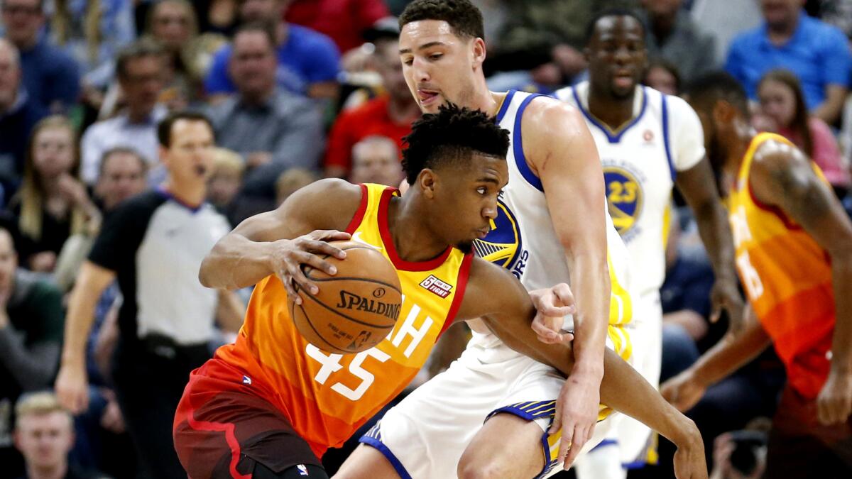 Jazz guard Donovan Mitchell, driving around Warriors All-Star Klay Thompson, has been compared to a young Damian Lillard by a Utah assistant who coached in Portland.