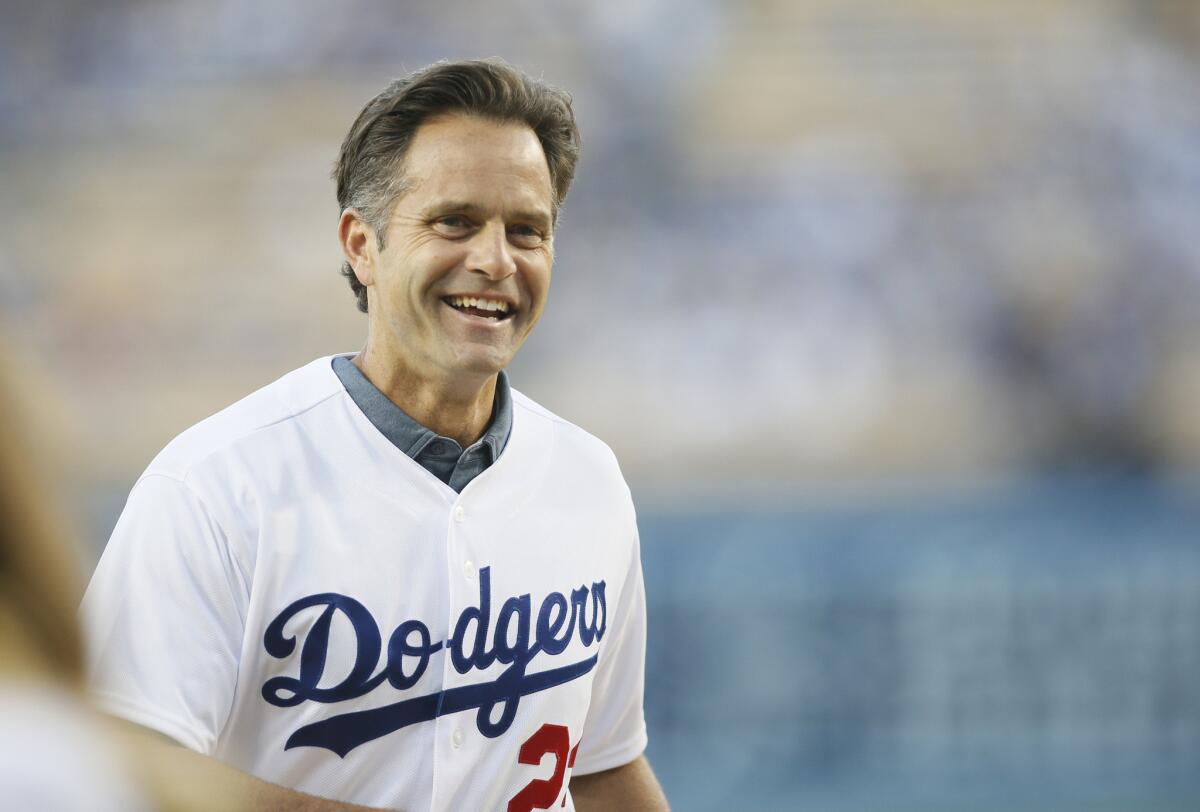 Former Dodgers first baseman Eric Karros smiles after throwing out a ceremonial first pitch before a game against the Arizona Diamondbacks on May 1.