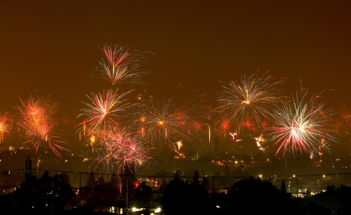 Fireworks explode in a 21-second timed exposure taken from Whittier on Monday.