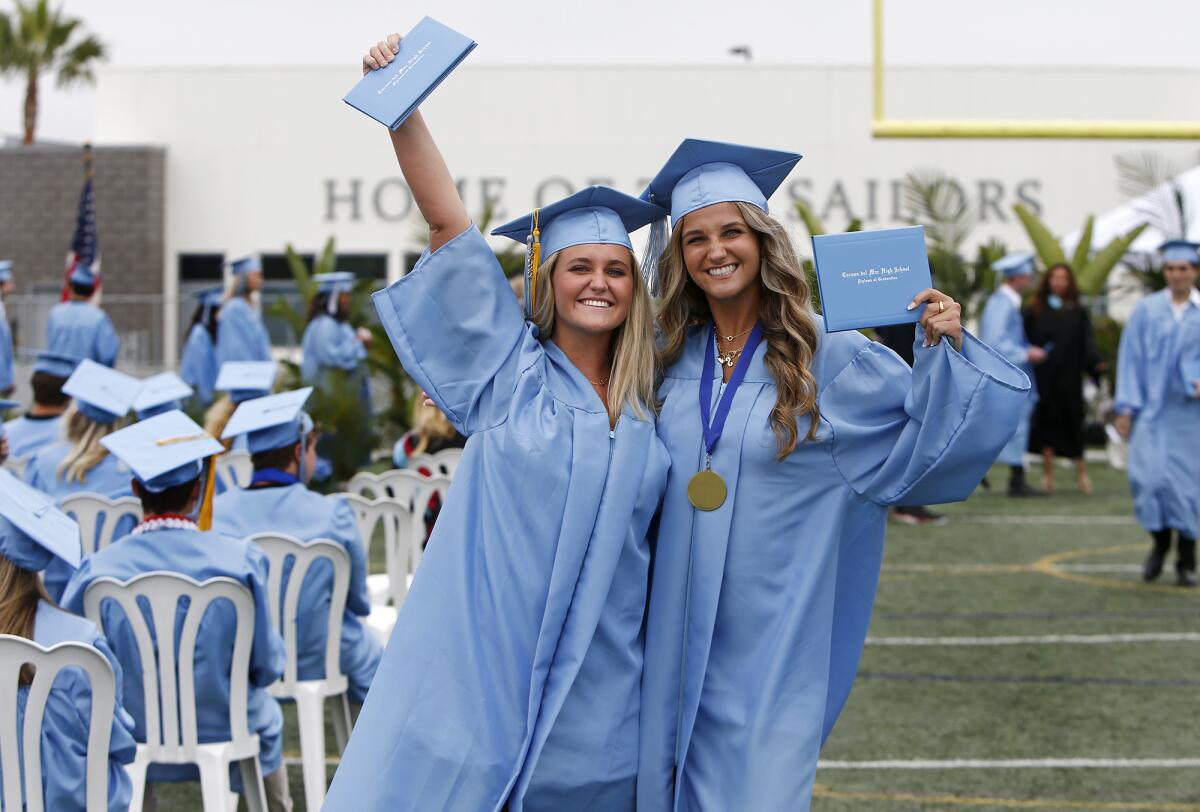 Samantha Forrester, left, and Sterling Fischer during Corona del Mar High School's commencement ceremony.