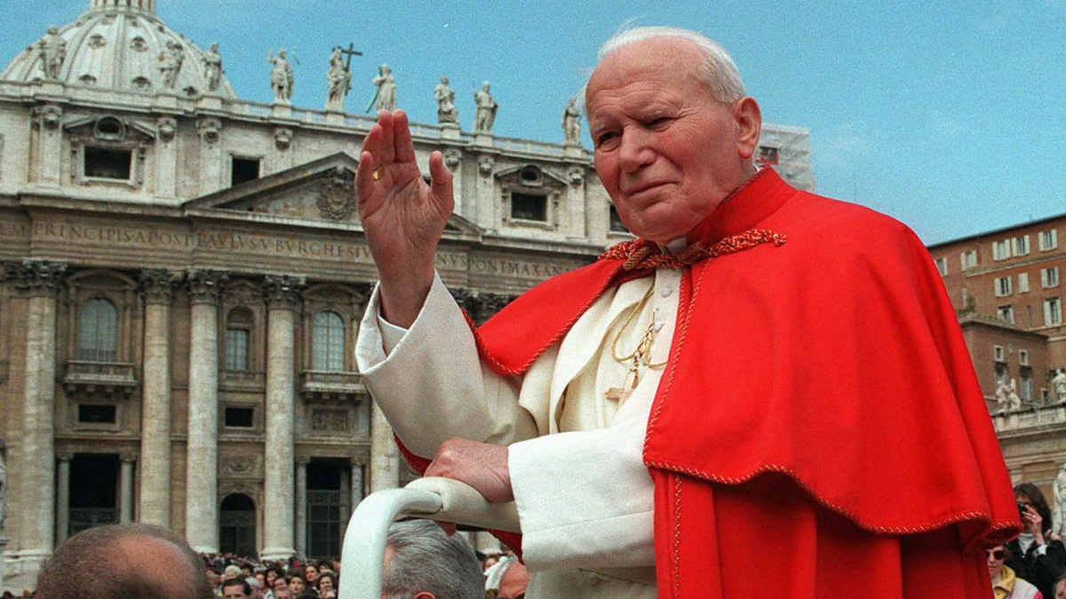 Pope John Paul II waves to the crowd in St. Peter's Square at the Vatican on April 23, 1997.