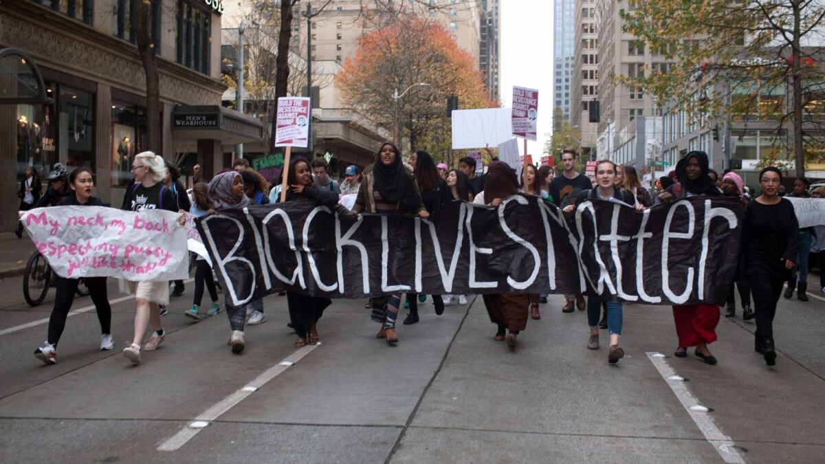 Protesters march through downtown Seattle.