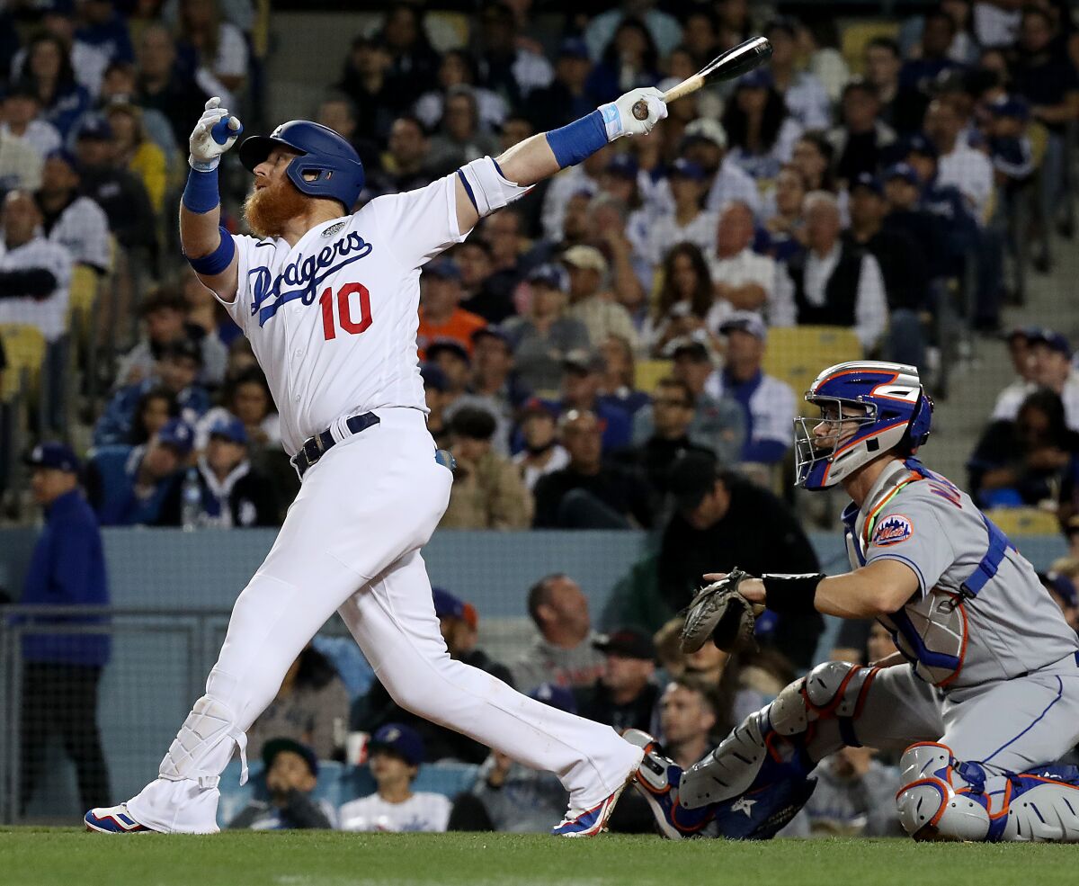 Dodgers third baseman Justin Turner hits an RBI double against the New York Mets.