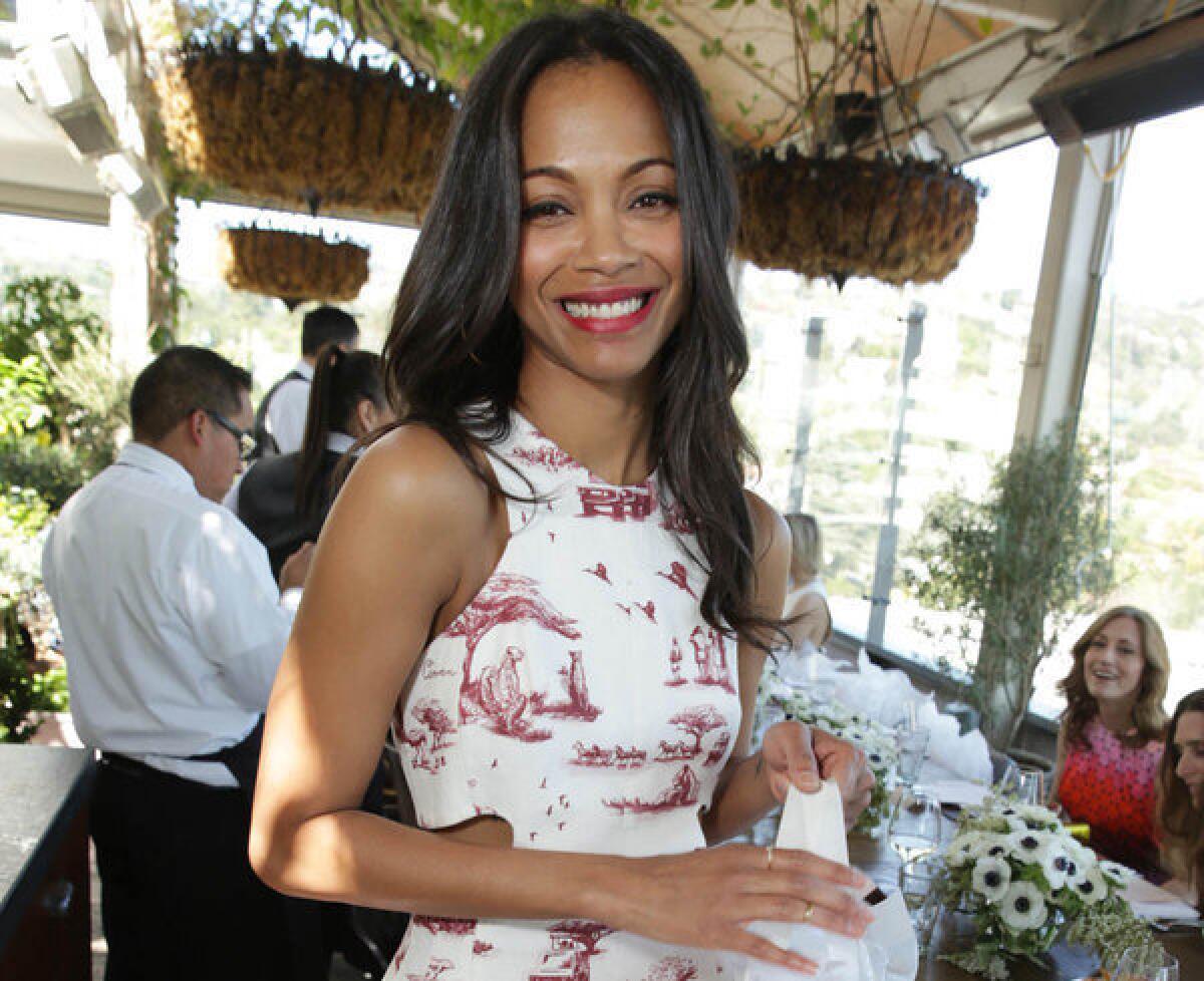 "I tend to recover, you know, healthy and smoothly" from heartbreak, Zoe Saldana tells Latina magazine.