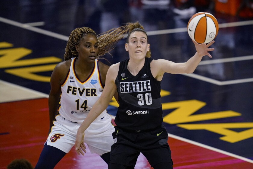 Seattle Storm forward Breanna Stewart gets a pass in front of Indiana Fever's Jantel Lavender during the first half of a WNBA basketball game in Indianapolis, Tuesday, June 15, 2021. (AP Photo/Michael Conroy)