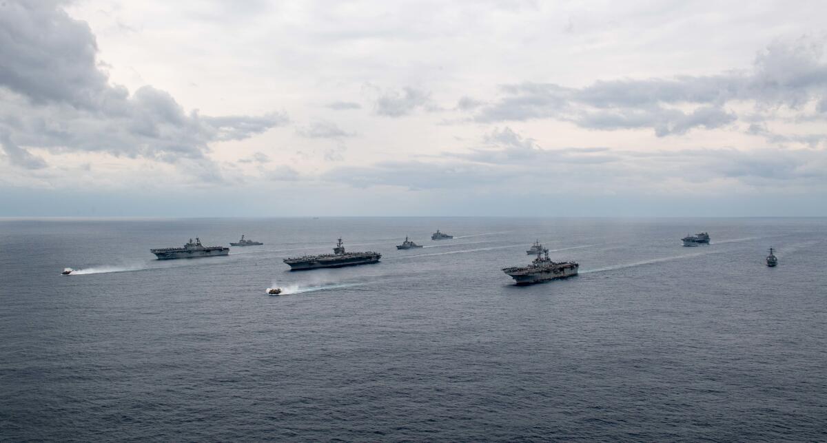 Abraham Lincoln and its strike group sail with the two Amphibious Ready Groups and the Japan Maritime Self-Defense Force.