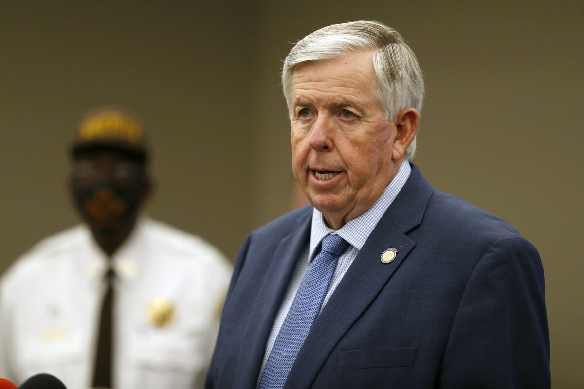 FILE - In this Aug. 6, 2020 file photo, Missouri Gov. Mike Parson speaks during a news conference in St. Louis. Gov. Parson, a Republican who has steadfastly refused to require residents to wear mask, and First Lady Teresa Parson tested positive for COVID-19, Wednesday, Sept. 23, 2020. (AP Photo/Jeff Roberson, File)