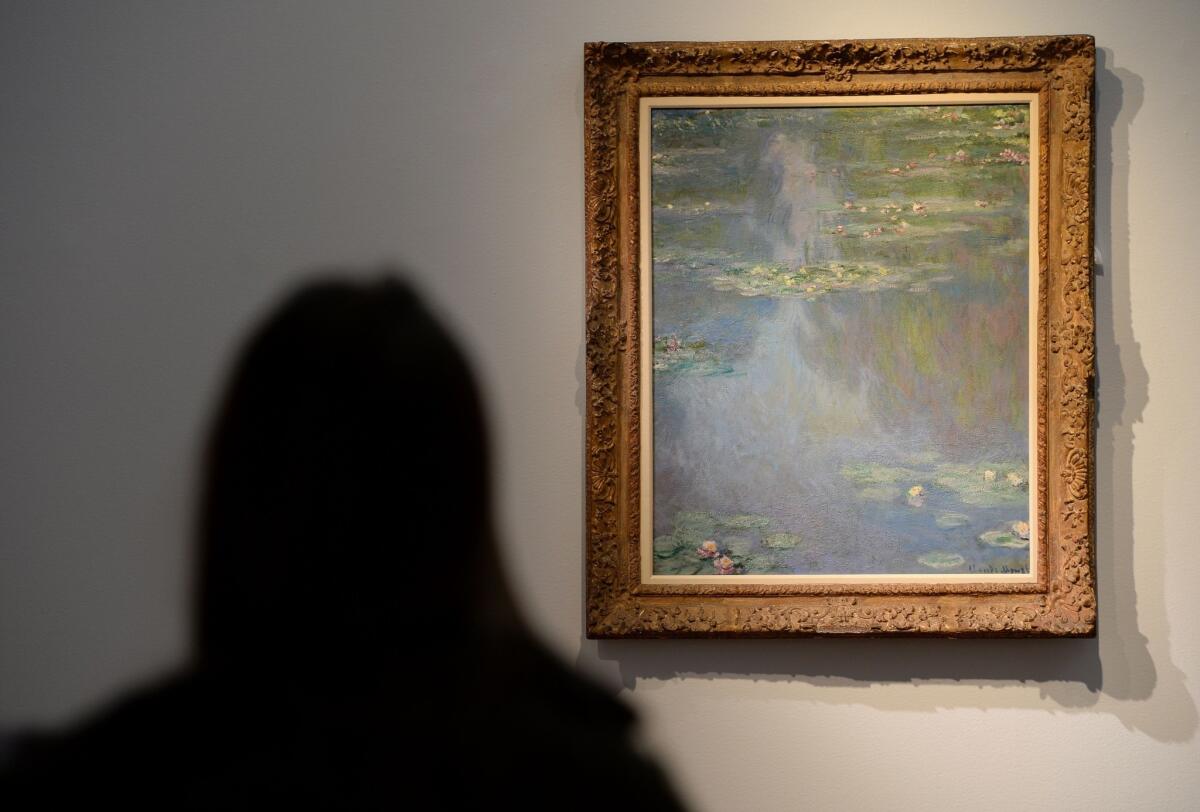 Claude Monet's "Nympheas", painted in 1907, on display during an auction preview at Christie's in New York.
