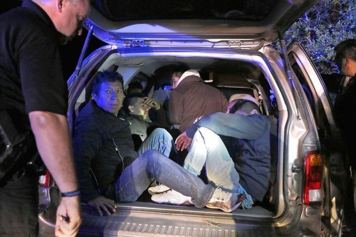 Brooks County sheriff's deputies stop a vehicle carrying Mexicans suspected of crossing illegally in Falfurrias, Texas. A Senate proposal to tighten border security calls for doubling Border Patrol officers, 700 miles of border fencing and drone surveillance flights.