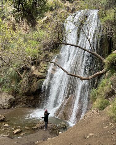 A hiker at the bottom of Escondido Falls.