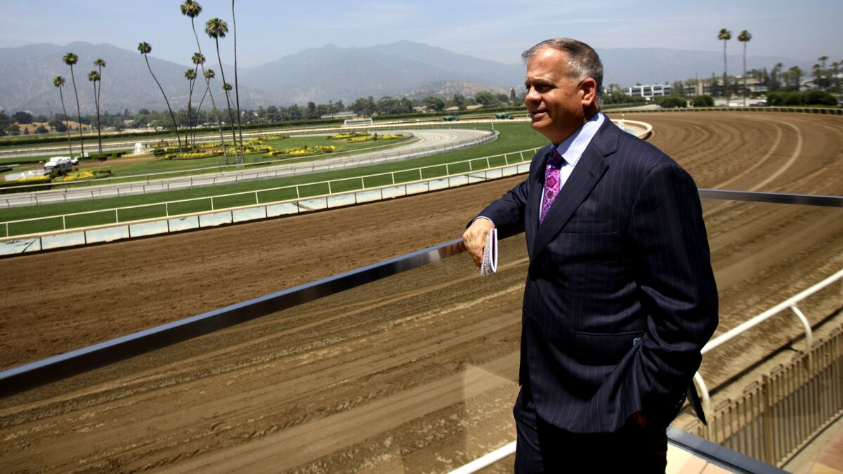 Tim Ritvo, chief operating officer of the Stronach Group, looks from the Eddie Logan Suite on a race day at Santa Anita Park last summer.