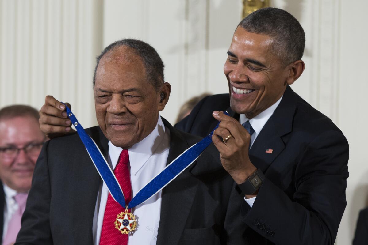 Willie Mays receives the Presidential Medal of Freedom from President Obama in 2015.