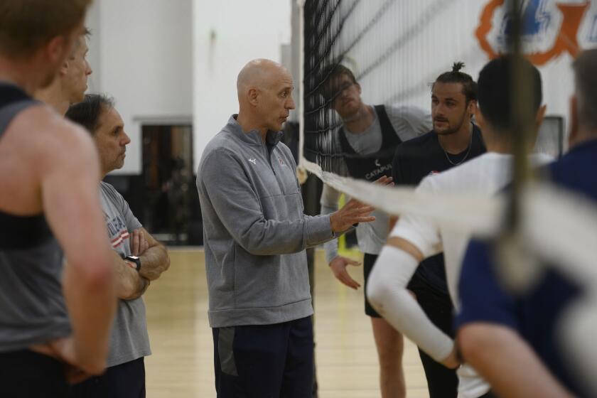 ANAHEIM CA MAY28, 2024 - USA Volleyball coach John Speraw, center, talks with his team during break at a practice session in Anaheim on Tuesday, May 28, 2024. (Paul Rodriguez / For The Times)
