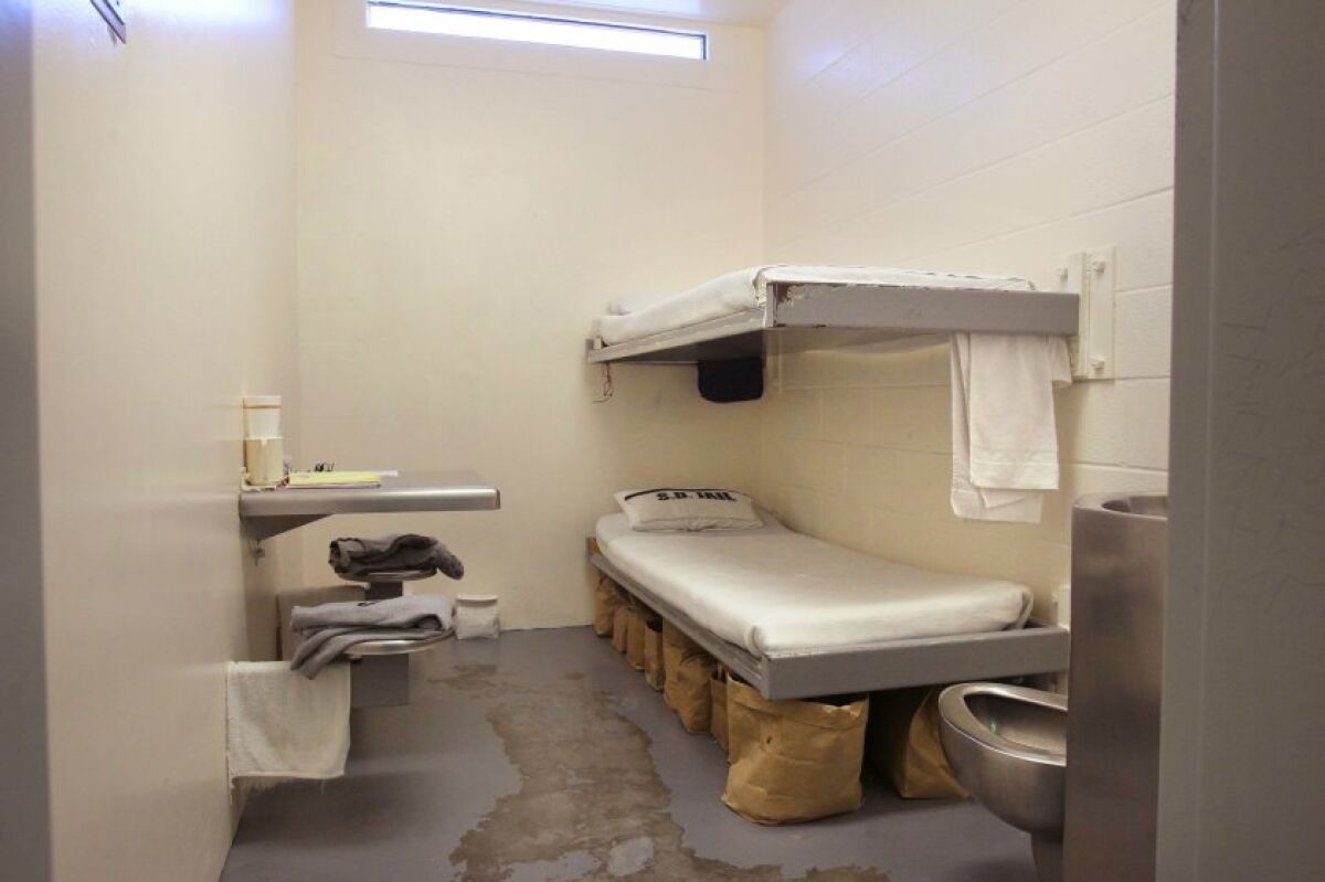 An inmate cell at the Vista Detention Facility has double bunks, toilet, and table bolted into wall