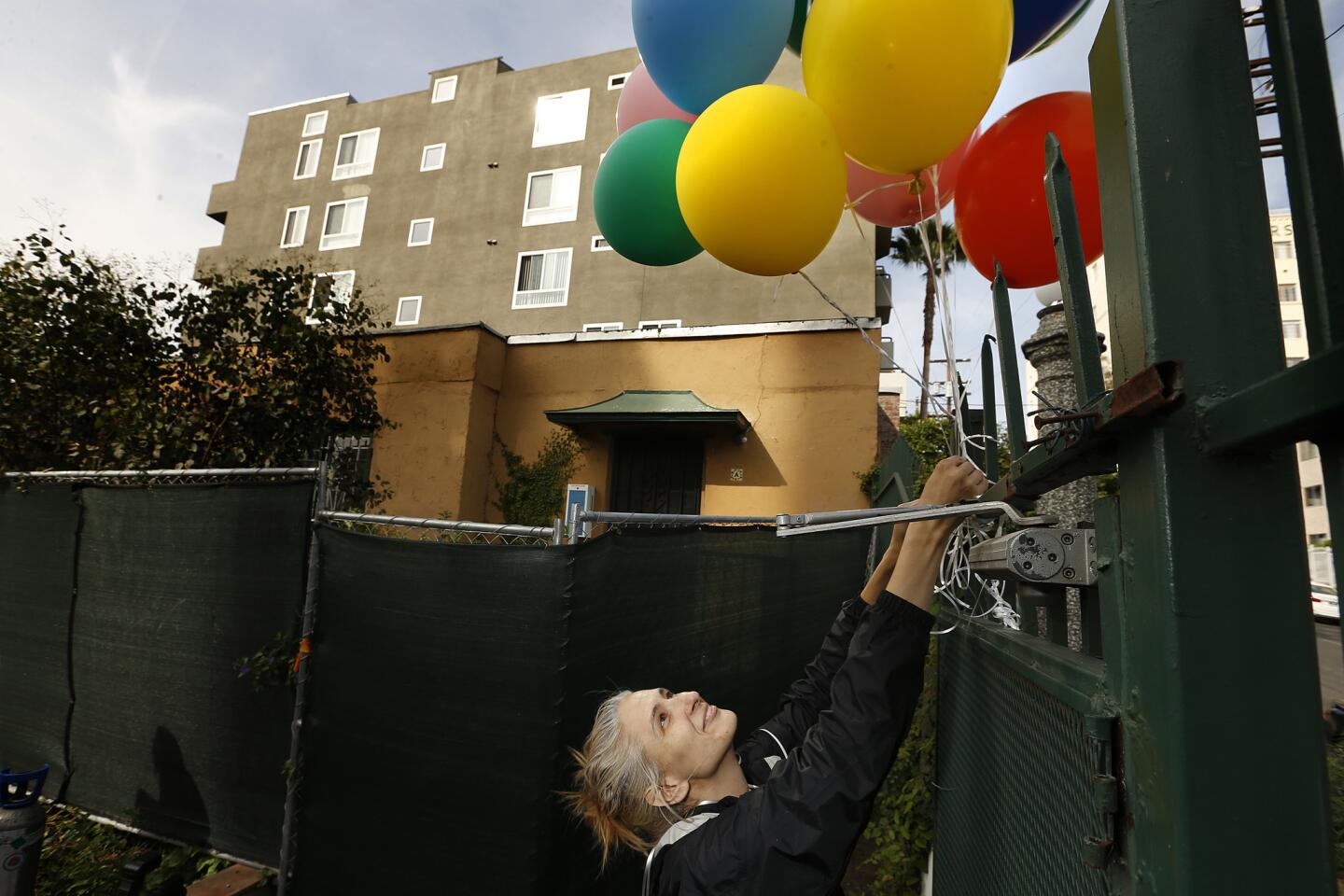 Artist Anne Hars has been placing balloons at several locations around Los Angeles in a symbolic gesture against small-lot developers who are pressuring tenants to move to make way for more pricey townhomes. The use of balloons to try to illuminate the issue, Hars said, was inspired by the animated film "Up" - the story an elderly resident who refuses to leave his home and uses balloons to put it in flight.