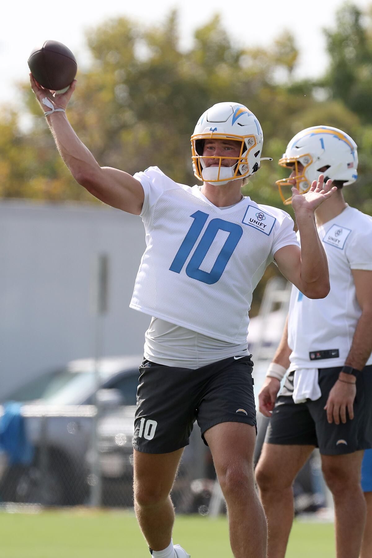 Quarterback Justin Herbert (10) throws a pass during the first day of Los Angeles Chargers training camp Wednesday.